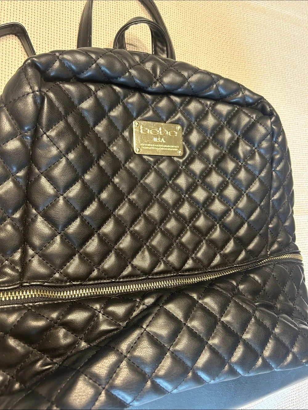 bebe Black Quilted Leather Backpack with Gold Plate
